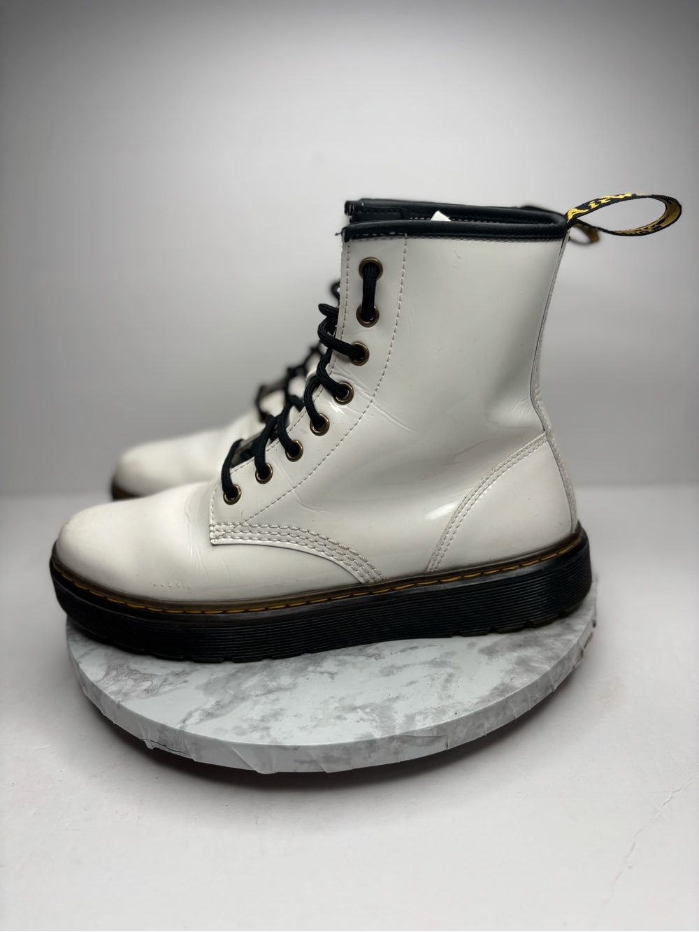 Sizes 8 M/ 9 W Dr. Martens Zavala combat boots feature a white patent leather